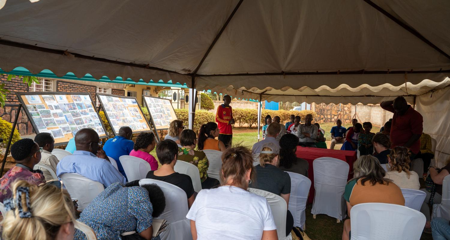 Students sitting for a presentation in Rwanda