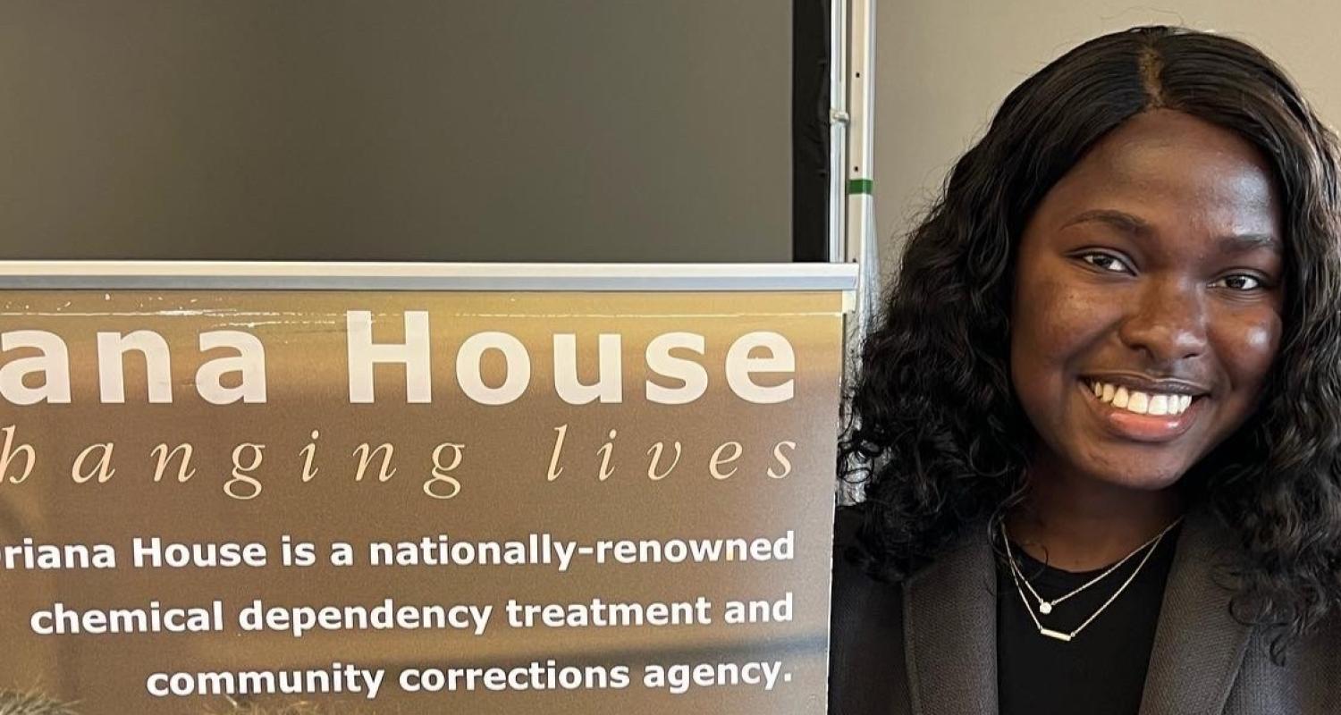 CPH alumna with Oriana House banner