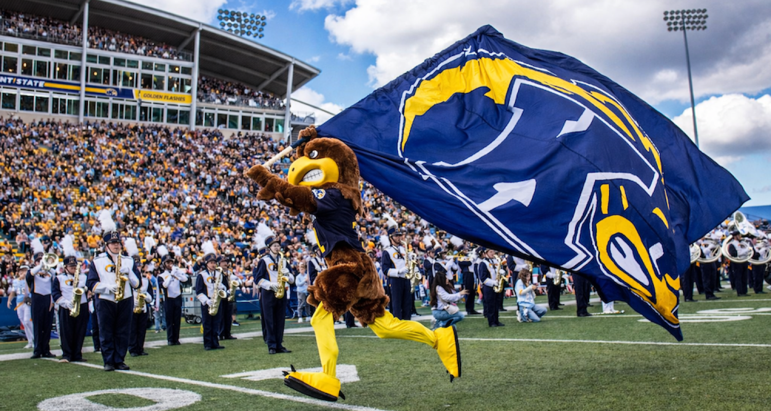 flash running with a kent state flag