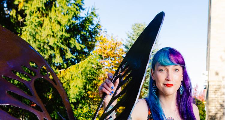 Butterfly sculpture with artist