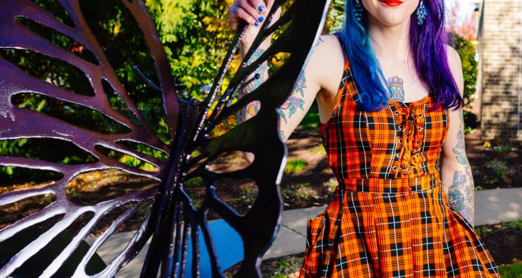 Butterfly sculpture with artist