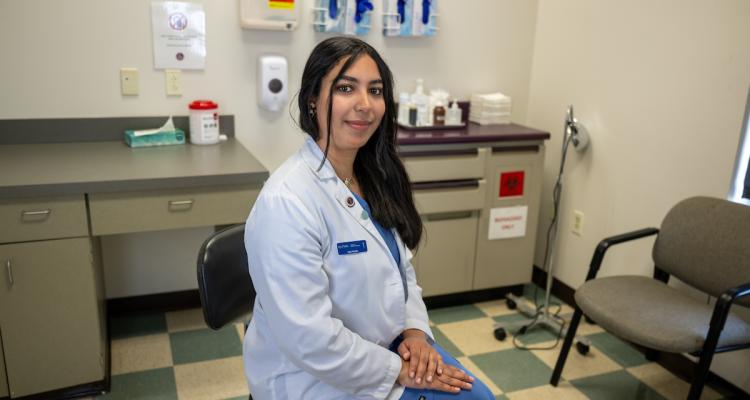 Ayat Husain, a student at 91����'s College of Podiatric Medicine, sits in one of the college's clinic rooms. (Photo credit: Bob Christy)