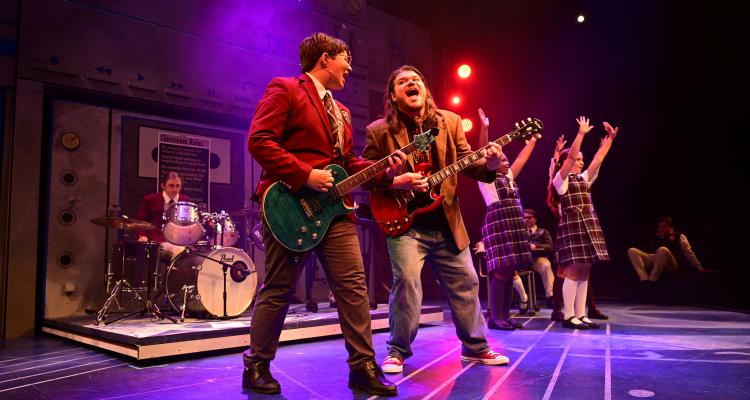 The cast of "School of Rock" performing on stage