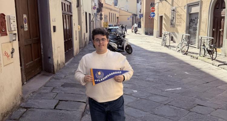 Matt holding a #flashesabroad pennant in Florence, Italy