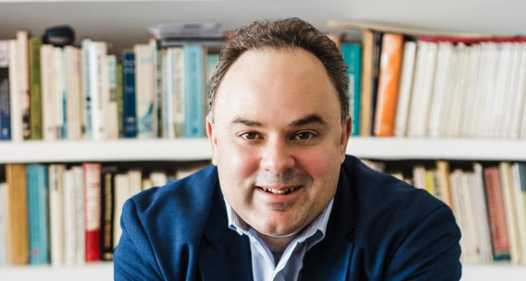 Photo of Evis Sammoutis in his office