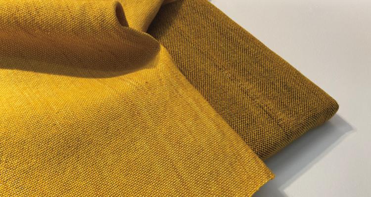 close up image of a yellow fabric folded in on itself