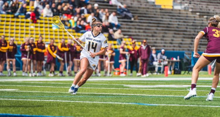 Honors College student Kenzie Sklar lines up to throw the ball during a lacrosse home game versus Central Michigan.