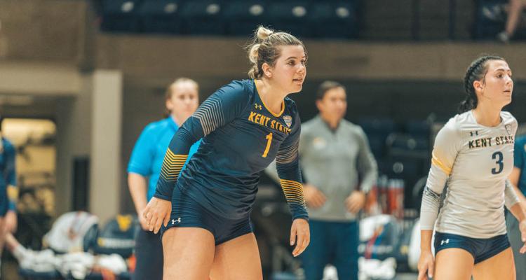 Kent State volleyball player and Honors College student Gracey Jarecke completes during a volleyball match.
