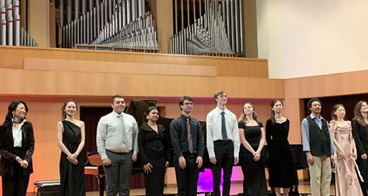 Students onstage at winter concert series performance