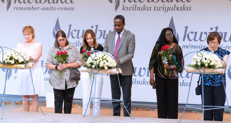 Pacifique laying flowers at the Rwanda Genocide Memorial