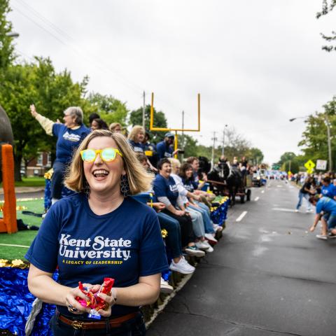 Students marching and celebrating in the Homecoming parade in Kent, Ohio.