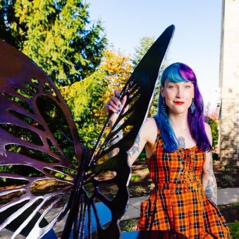 Butterfly sculpture with artist