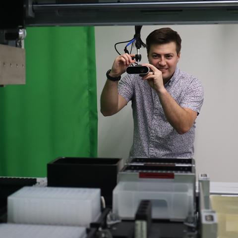David E. Silva adjusts a volumetric camera