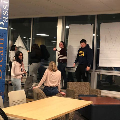 students helping