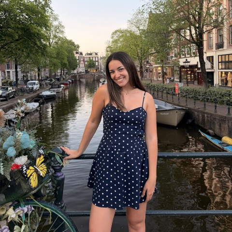 Student standing in front of canal