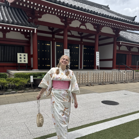 Ashley dressed in a kimono in front of a temple