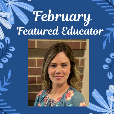 Woman in flowered shirt with blue background