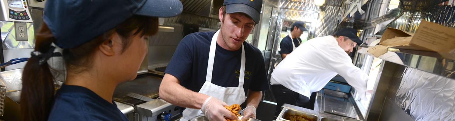 Student worker making food 