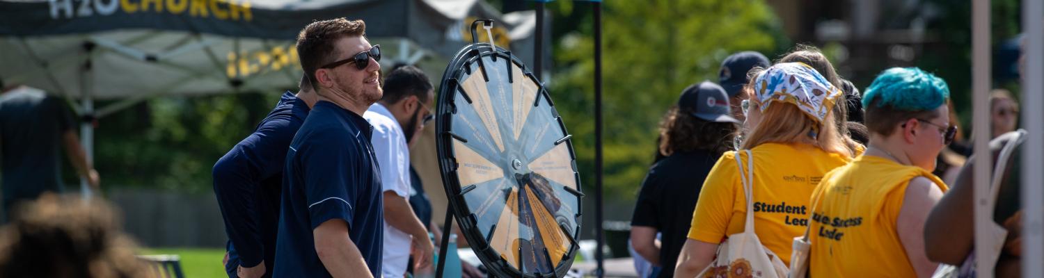 a staff member offers resources to new students