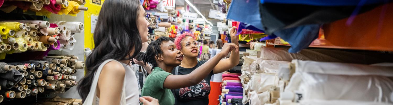 School of Fashion Students shopping for fabrics in NYC Garment District as part of the NYC Study Away Program