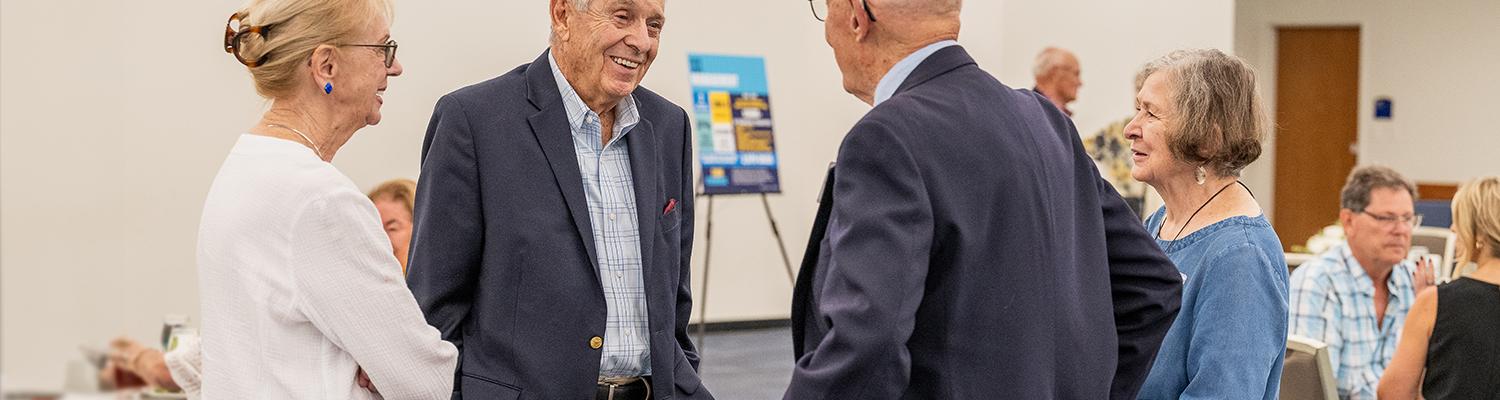 Members of the Herrick Society attend the annual luncheon in September 2025.