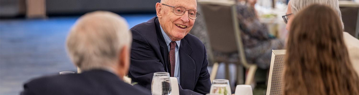 A member of the Herrick Society attends the annual luncheon in September 2025.