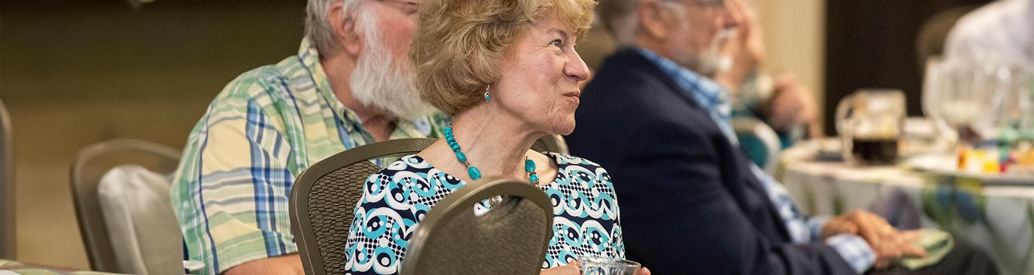 A member of the Herrick Society attends the annual luncheon in September 2025.