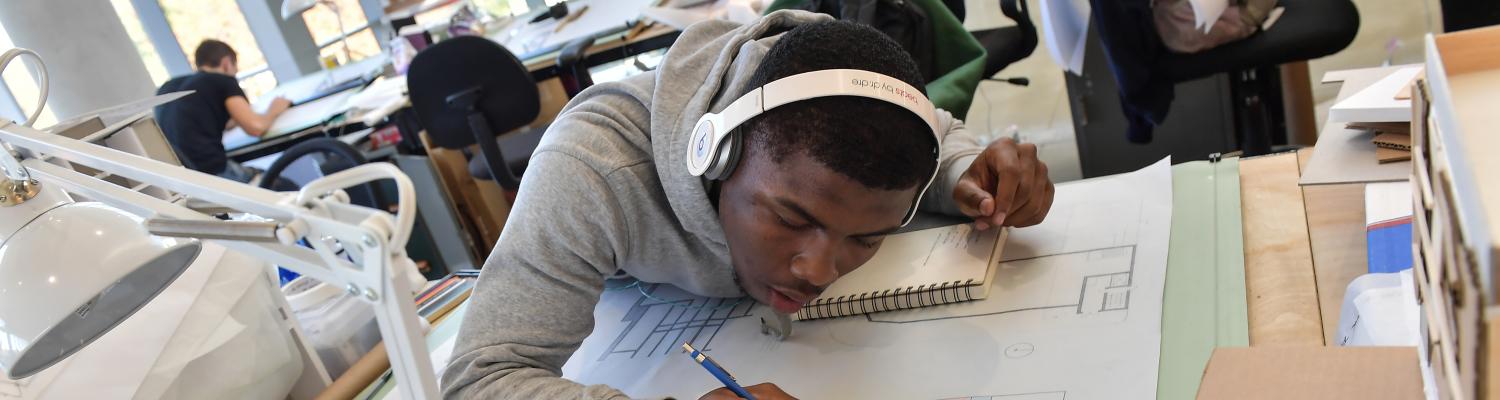 An Upward Bound student studying at a desk