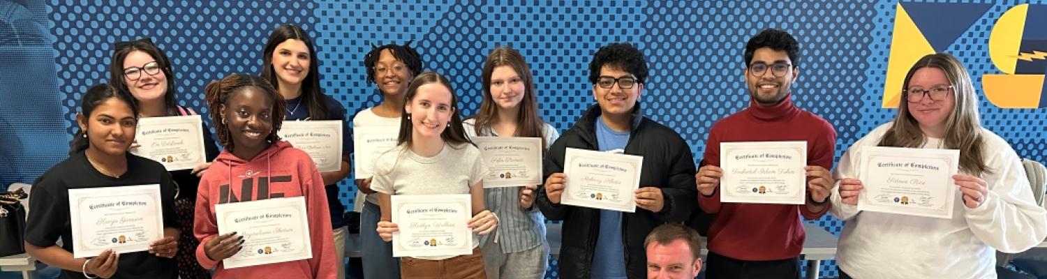 Group of students holding their leadership certifications