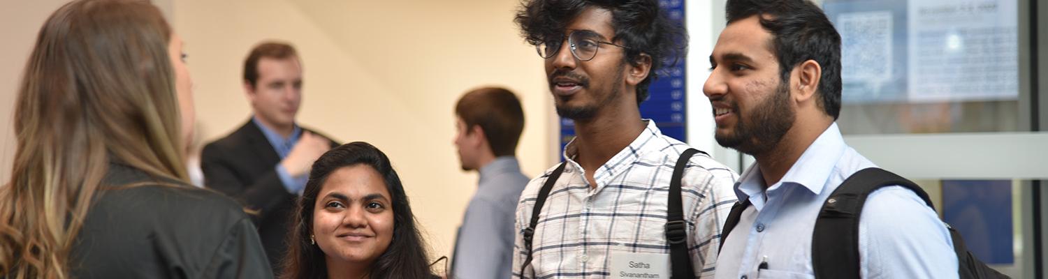 Students discuss career options with a recruiter at the 2023 CAE Career Fair
