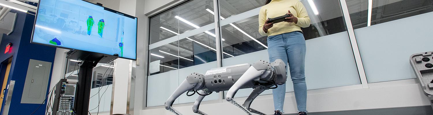 Student controls a robotic dog
