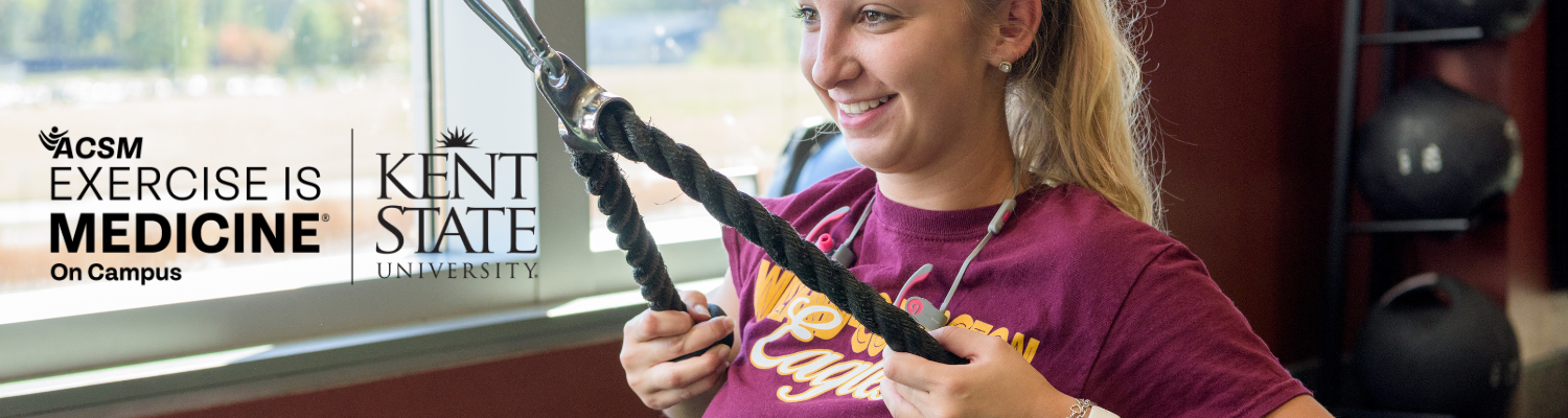 Woman using cable pulldown machine while smiling with Exercise is Medicine and Ģ����ý logo overtop