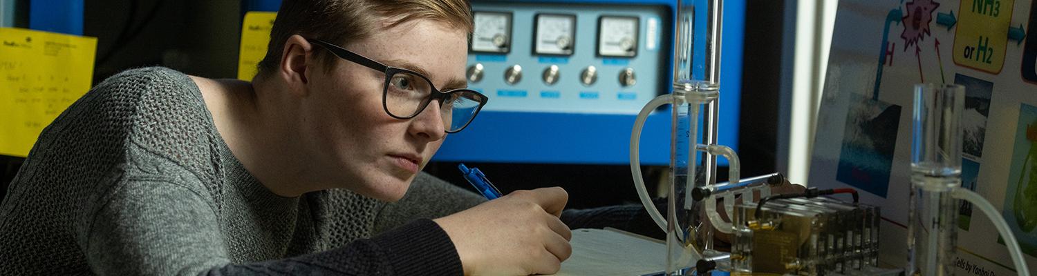 Graduate Engineering student observes their project
