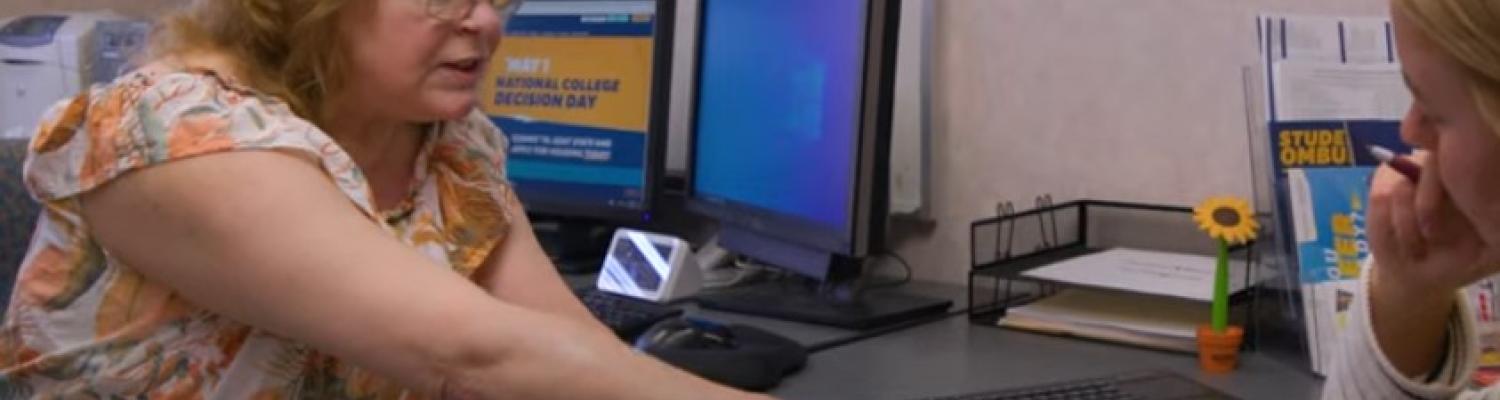Advisor working with students