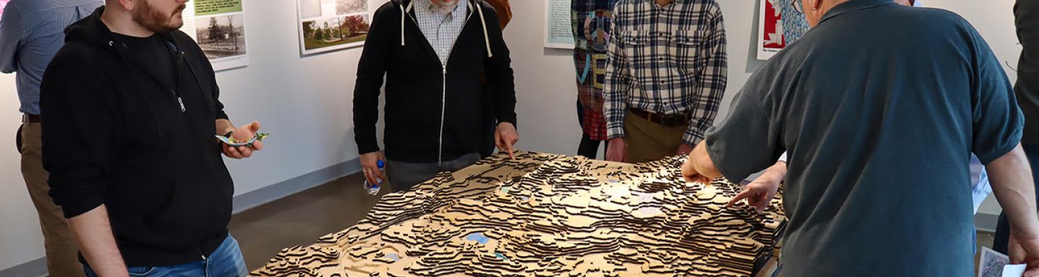 photo of people viewing gallery exhibit
