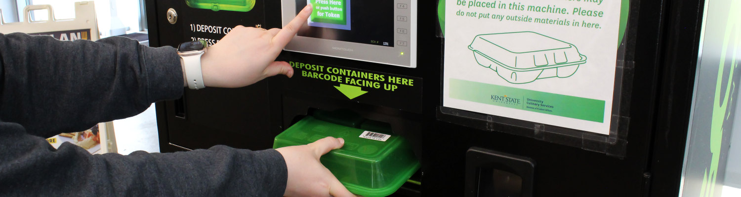 Person inserting an OZZI container into the OZZI machine and pressing the button for a return token