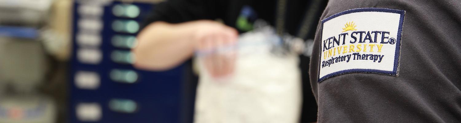 Close up of a patch that reads �Ը������� University Respiratory Therapy