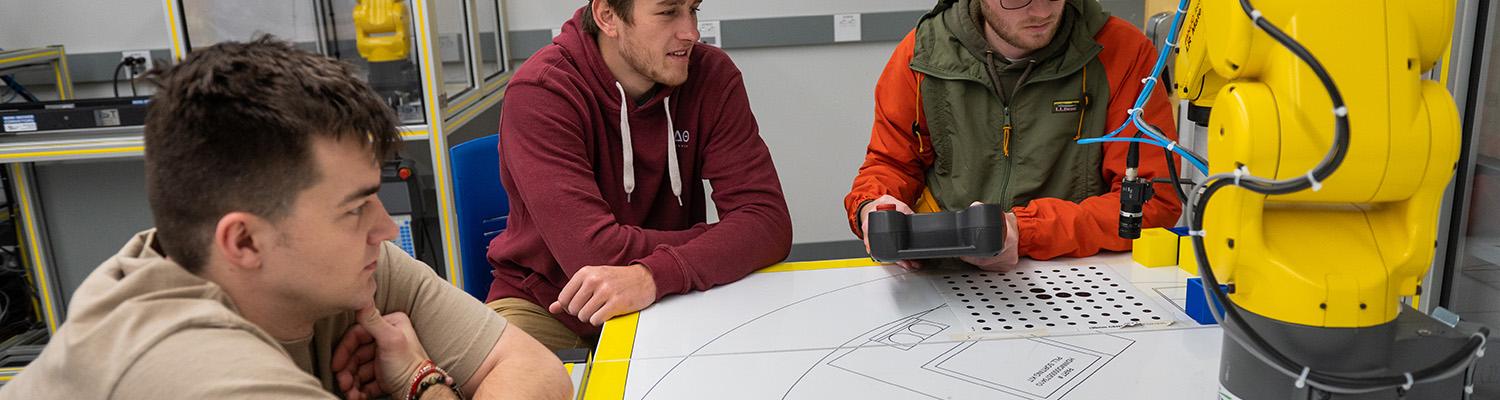 CAE students program an industrial robot