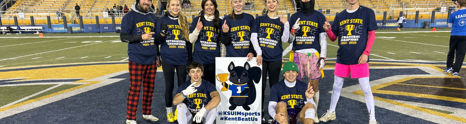 Flag Football group of men and women posing to celebrate winning their championship game 
