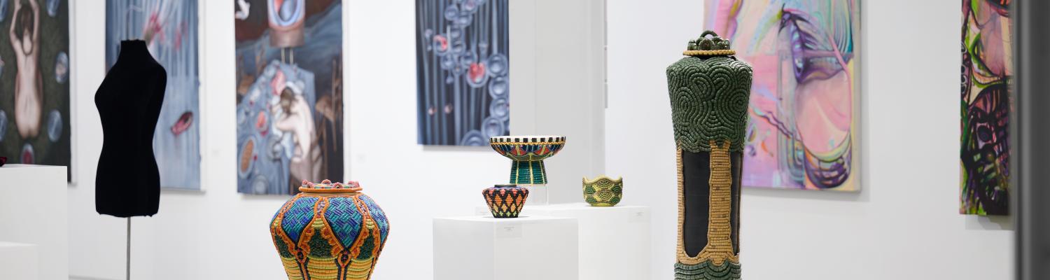 Various handmade vases on display on in a gallery