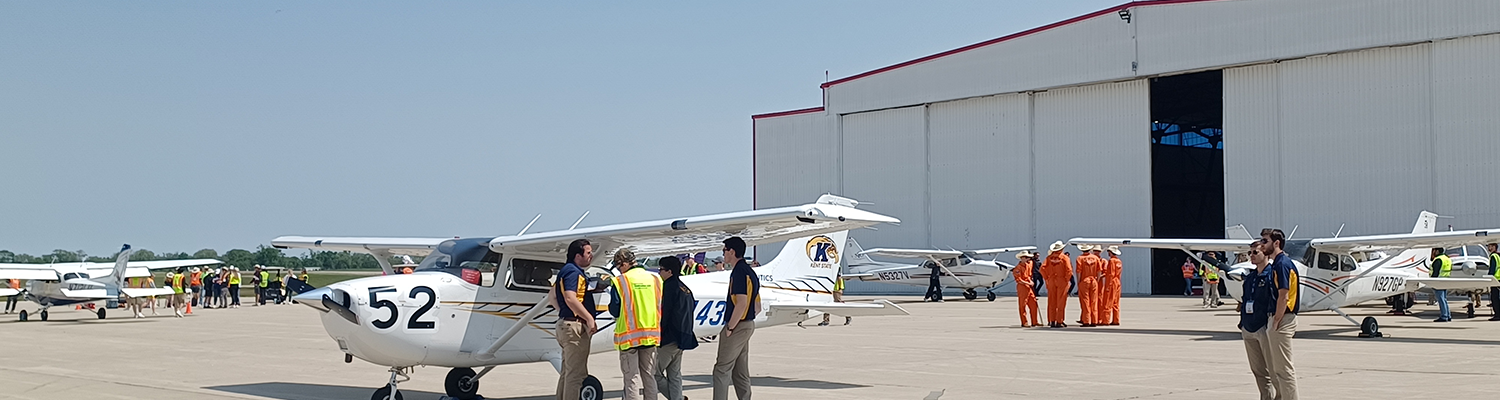 Students from 51���� and surrounding schools stand by their planes outside a hangar at the 2024 NIFA SAFECON.