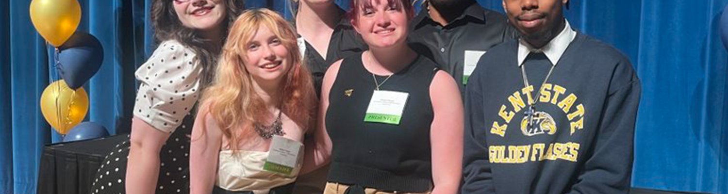 A group of six Peer Success Academy students at a celebration.