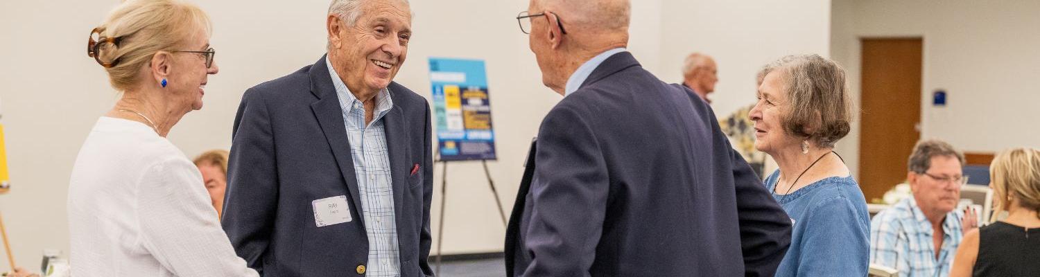 Members of the Herrick Society attend the annual luncheon in September 2025.