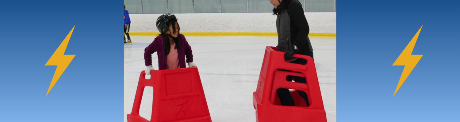 Photo of parent and child using skate helpers on the ice. 