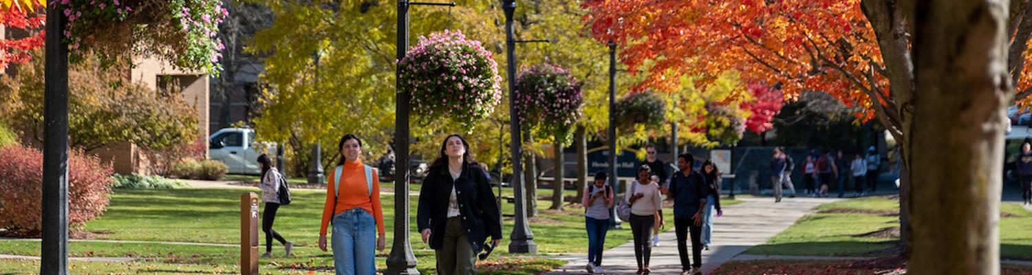 51���� students walk across campus on a fall day. (Photo credit: Bob Christy)