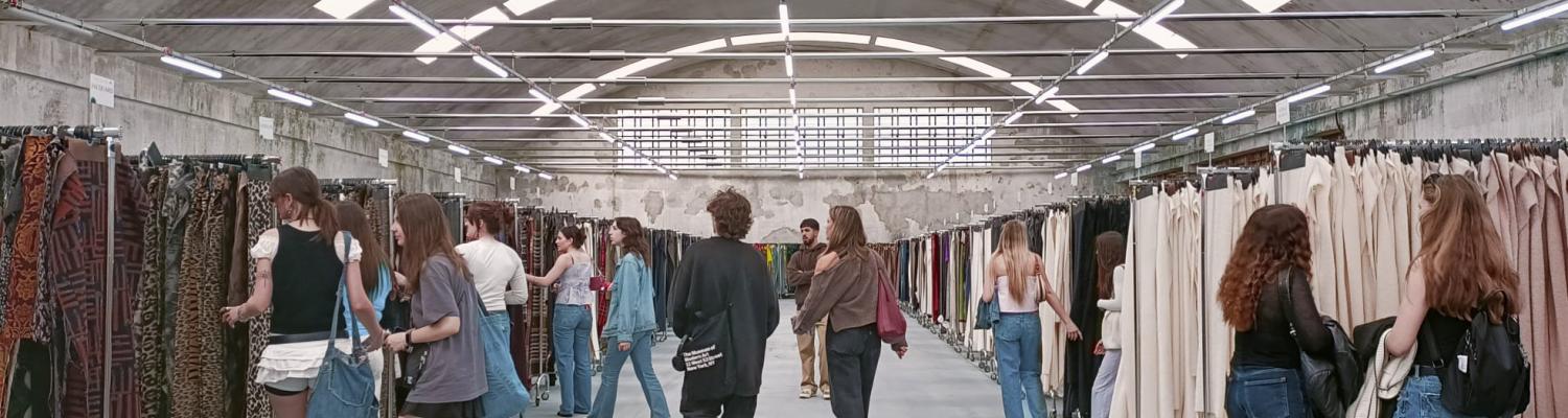 Students walking down hallway of textile archives