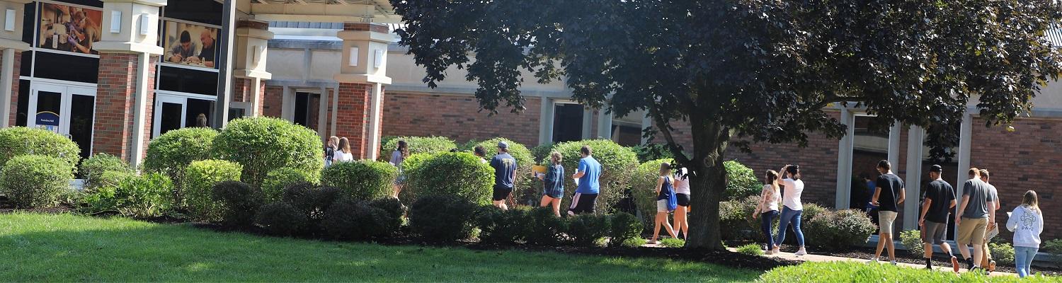 Students walking into Founders Hall