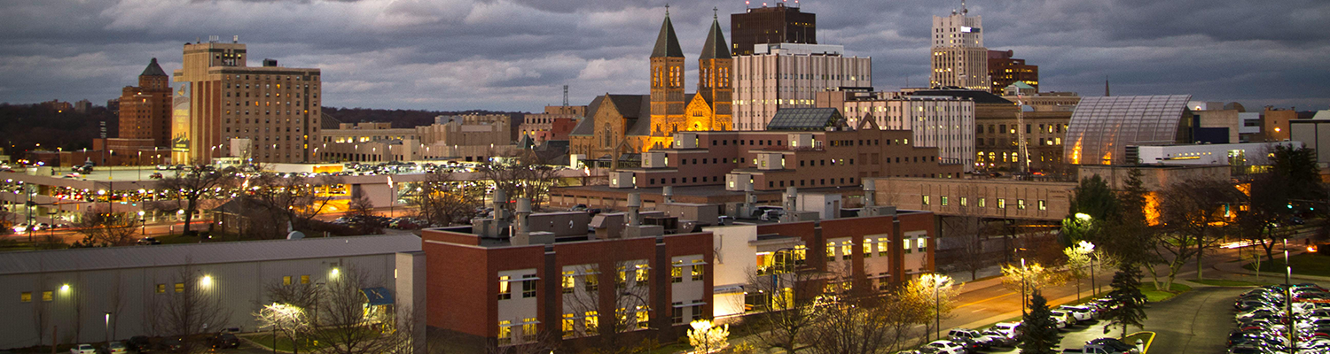 The Akron skyline in front of a cloudy sky
