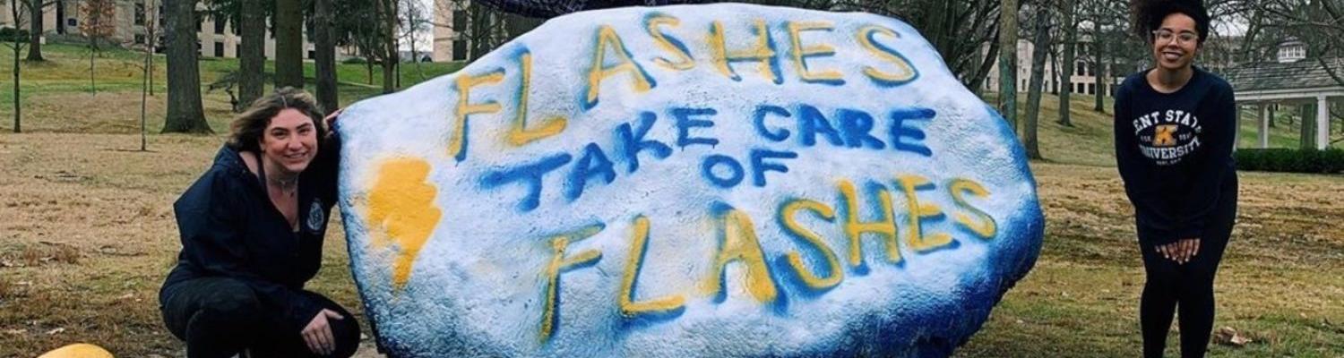 Members of Kent State University's Undergraduate Student Government Painted "Flashes Take Care of Flashes" on the Rock on Front Campus.