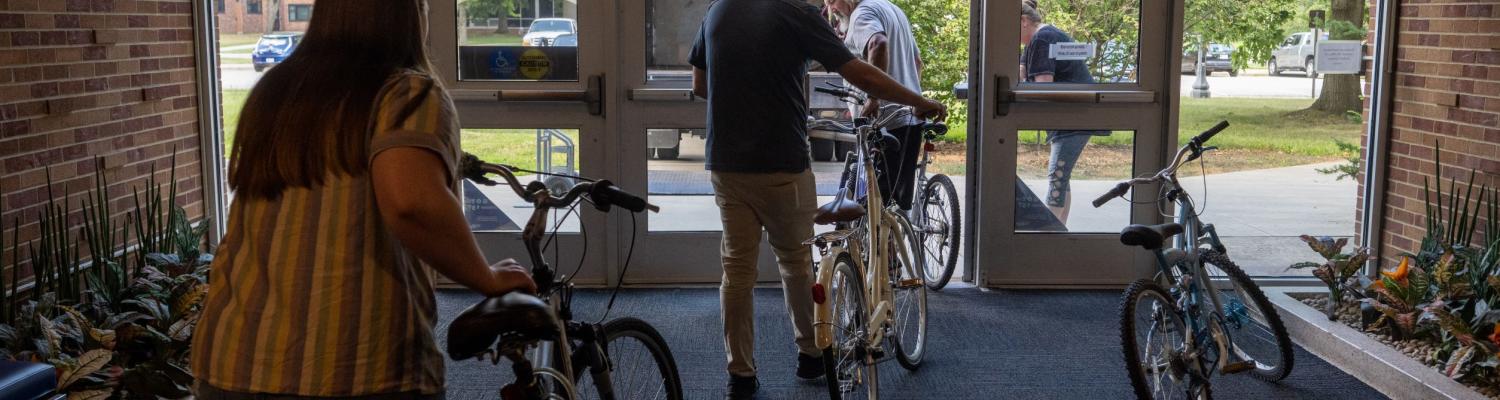 University Housing employees help load bicycles for delivery to Family and Community Services in Ravenna